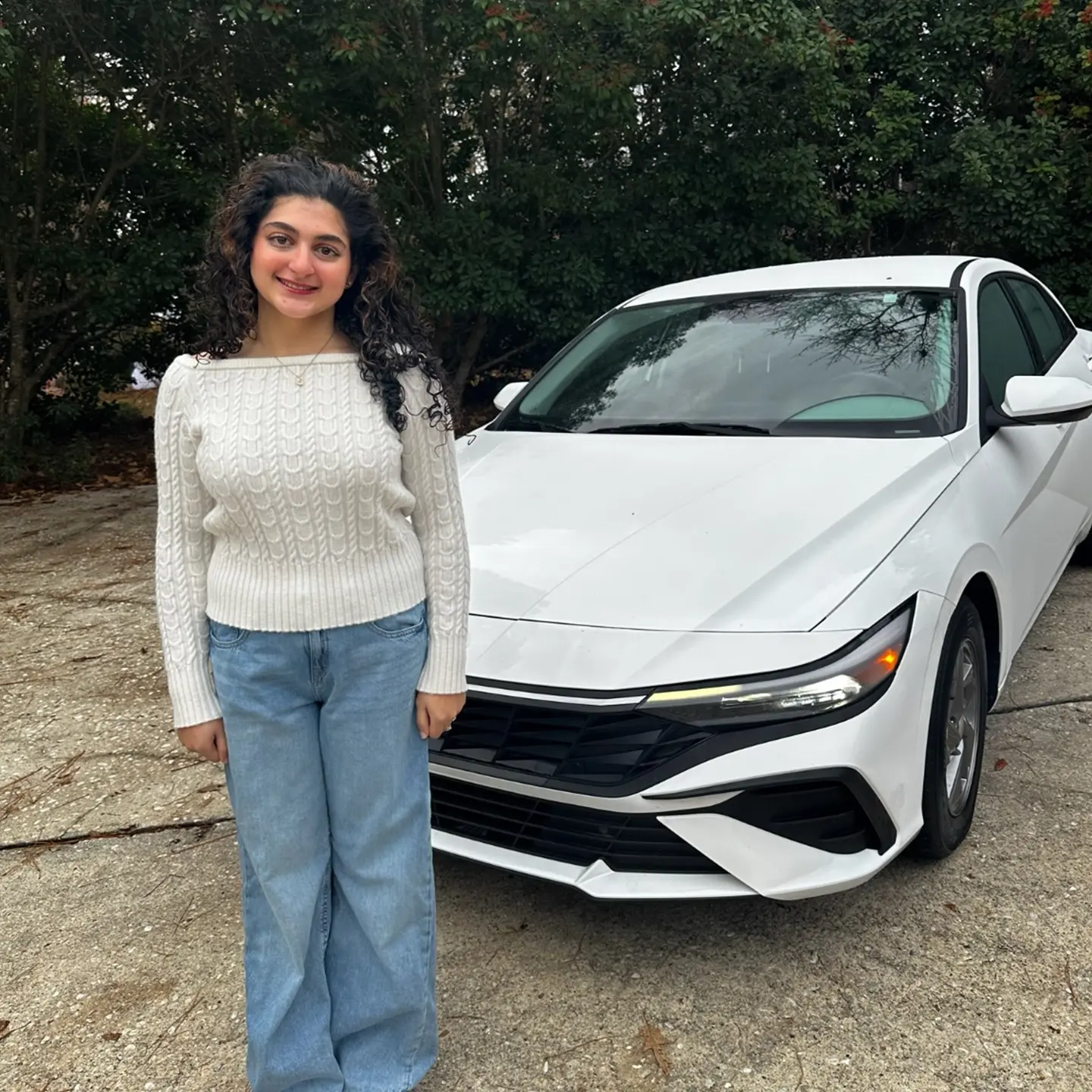 Lee's Auto Sales customer with their new vehicle